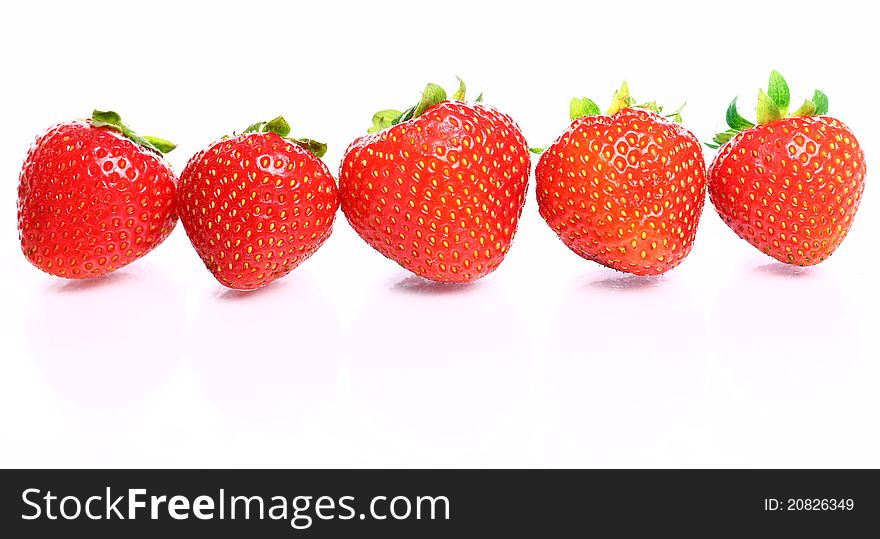 Close Up of fresh strawberry berries on white background