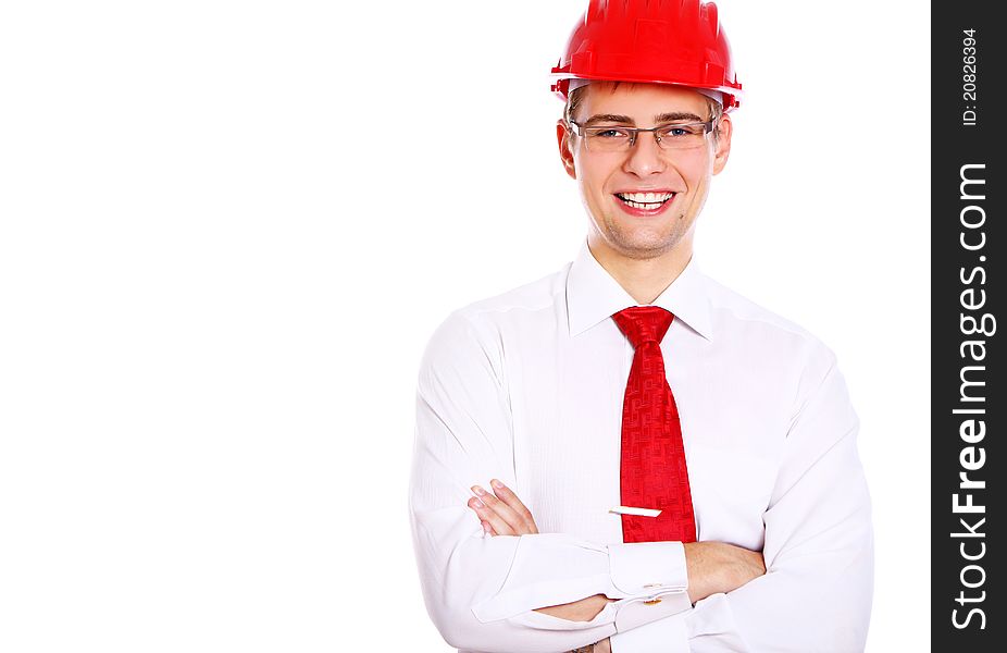 Young smiling architect in red helmet isolated over white background. Young smiling architect in red helmet isolated over white background
