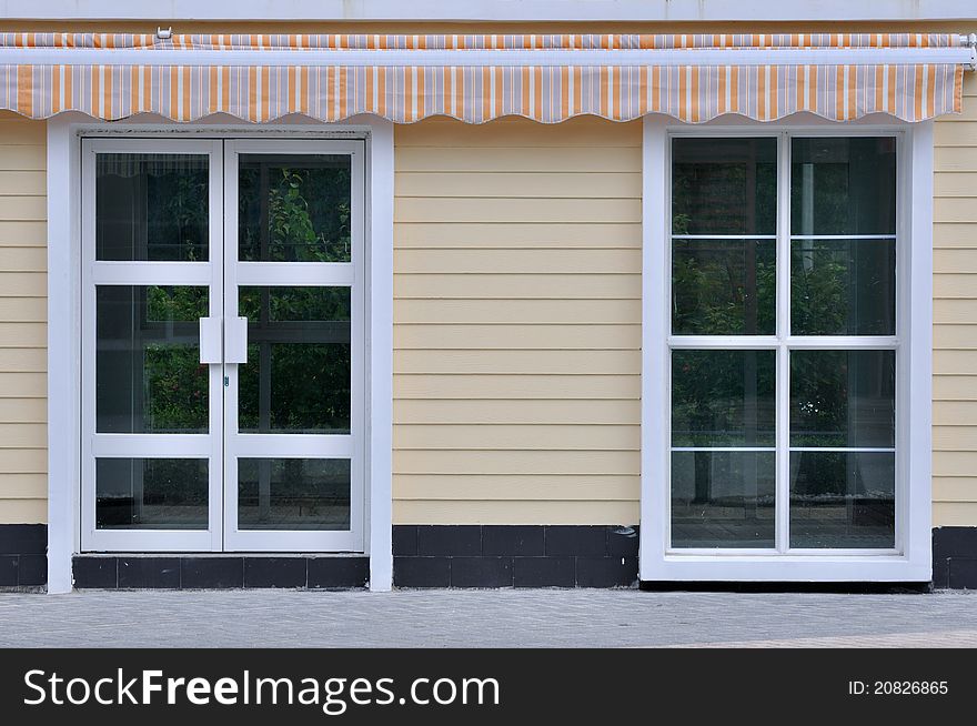 Part of decorated architecture, including door, window and shed, shown as featured architecture pattern and beautiful living environment. Part of decorated architecture, including door, window and shed, shown as featured architecture pattern and beautiful living environment.