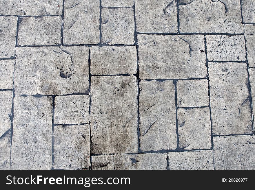 Grey background of stone texture wall in daylight