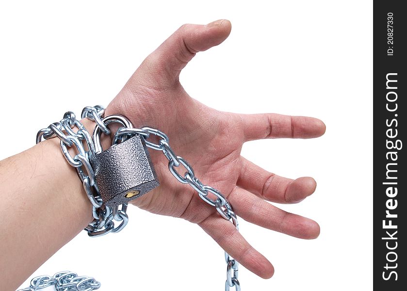 Color photo of a man's hand and a metal chain. Color photo of a man's hand and a metal chain