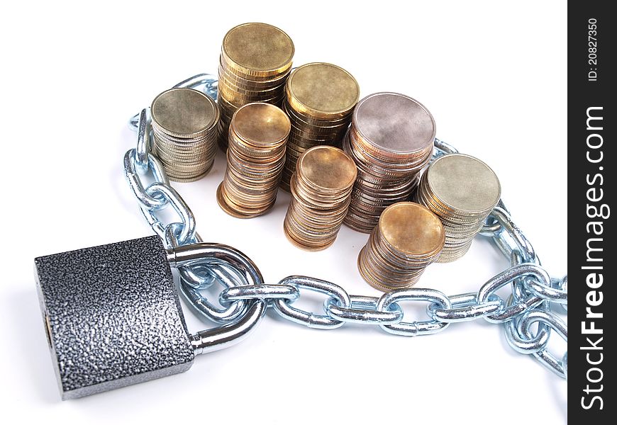 Color photo of pile of coins and a padlock with chain. Color photo of pile of coins and a padlock with chain