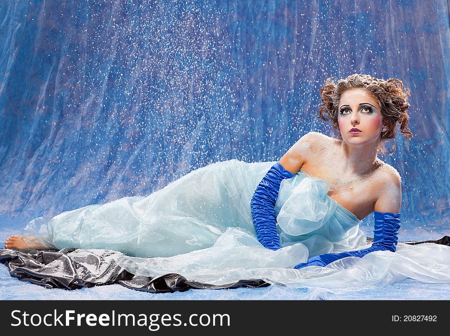 Beautiful girl like Snow White on blue background