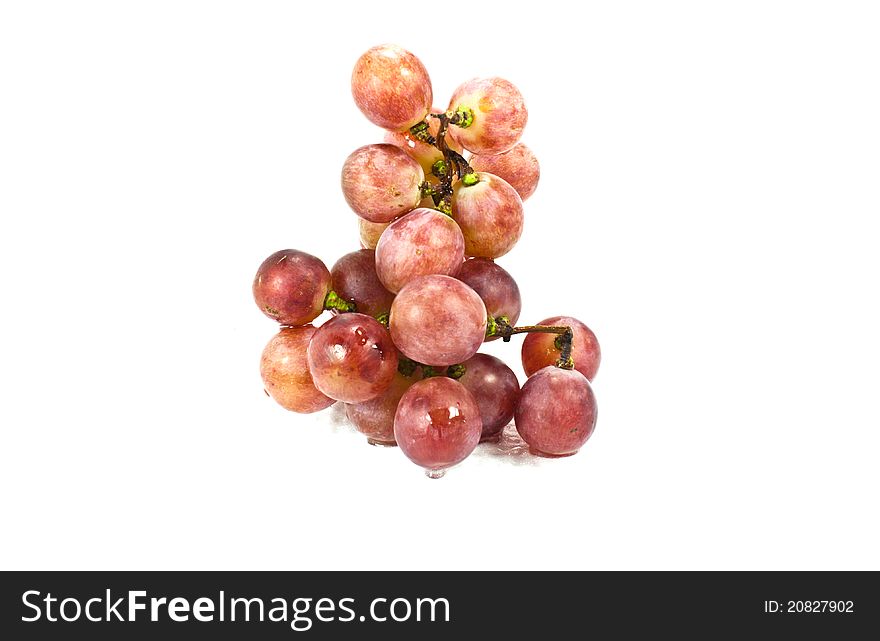 A bunch of red grapes. Place isolated on white background.