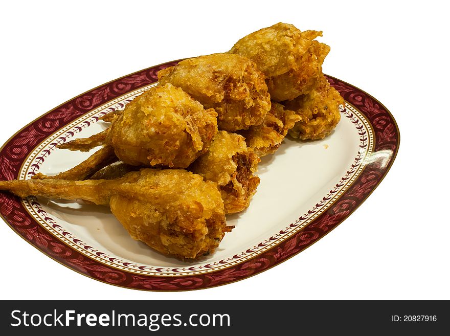 Several pieces of fried chicken leg. Arranged on the plate. Several pieces of fried chicken leg. Arranged on the plate.