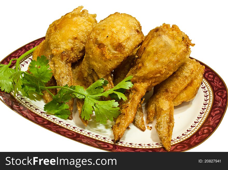 Several pieces of fried chicken leg. Arranged on the plate. Several pieces of fried chicken leg. Arranged on the plate.