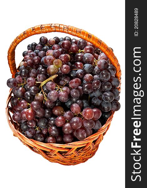 Grapes in a basket isolated on white