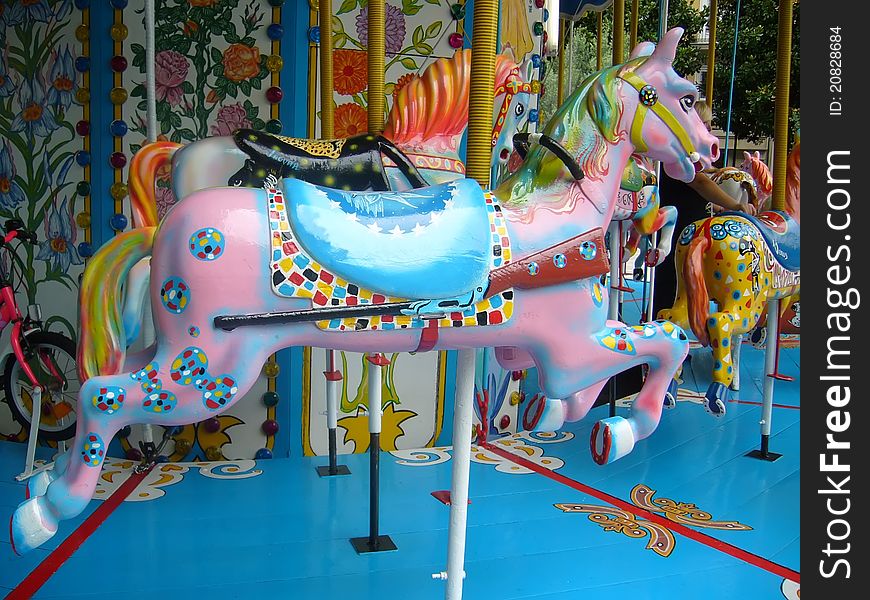 Several colorful horses in a carousel. Several colorful horses in a carousel