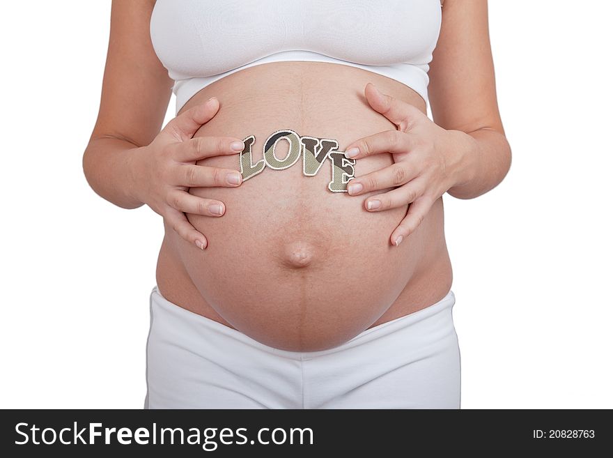 Pregnant woman hold word love on a belly on white background