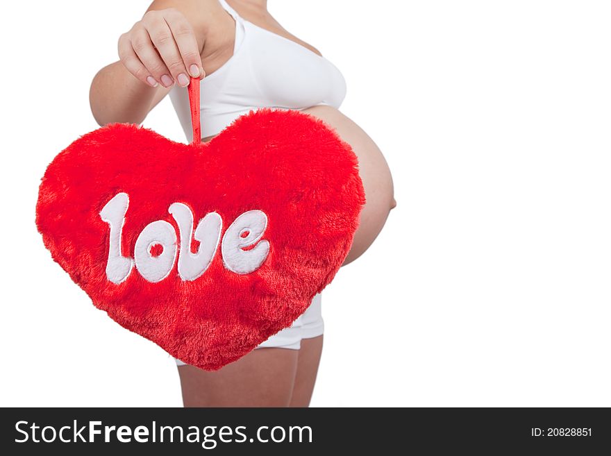 Pregnant woman hold red hart with love in hands on white background