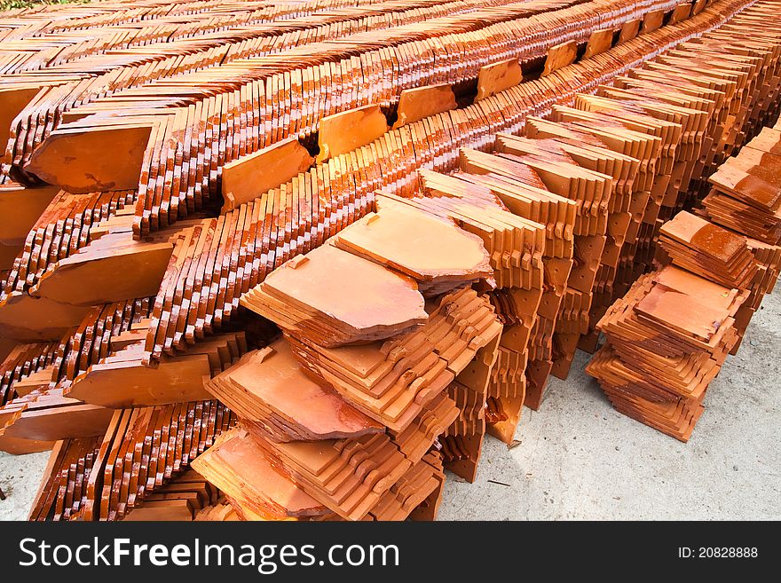 Stack of ceramic roof tiles for make Thai Church