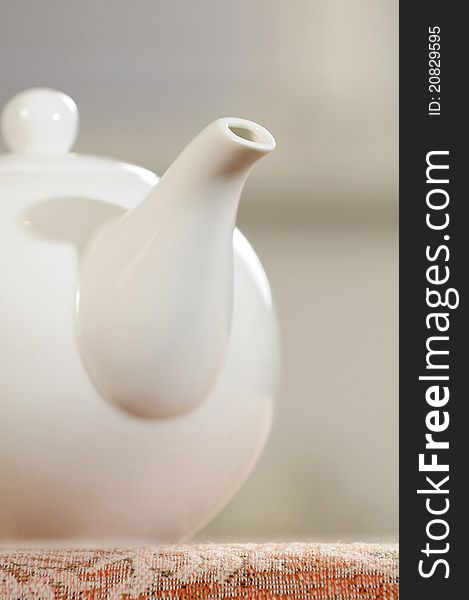 White porcelain kettle on coffee table