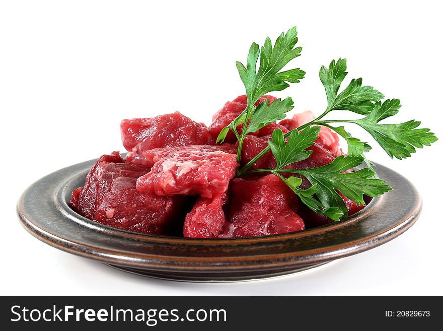 A plate of fresh raw beef goulash