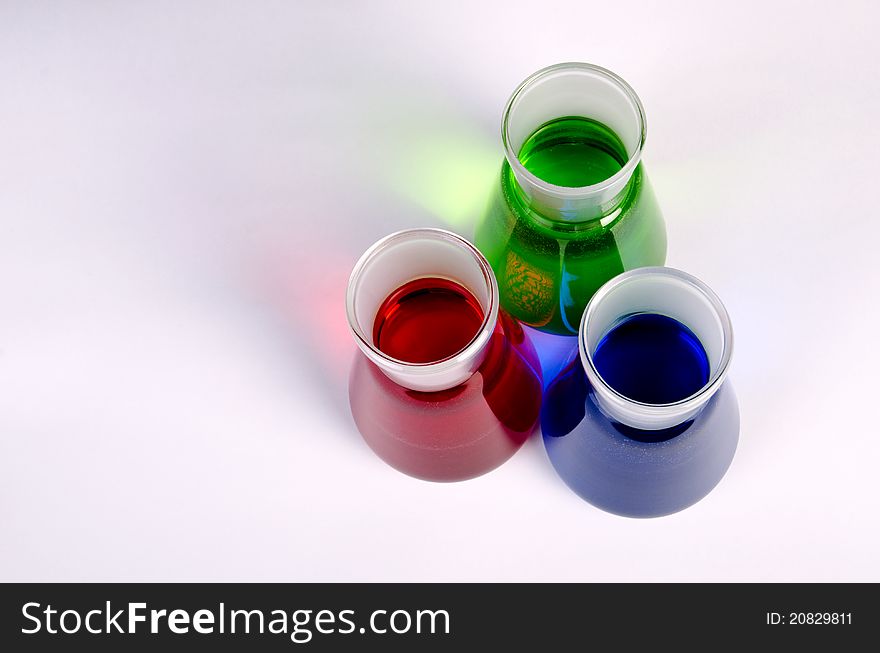 3 colors chemicals in laboratory glassware. 3 colors chemicals in laboratory glassware