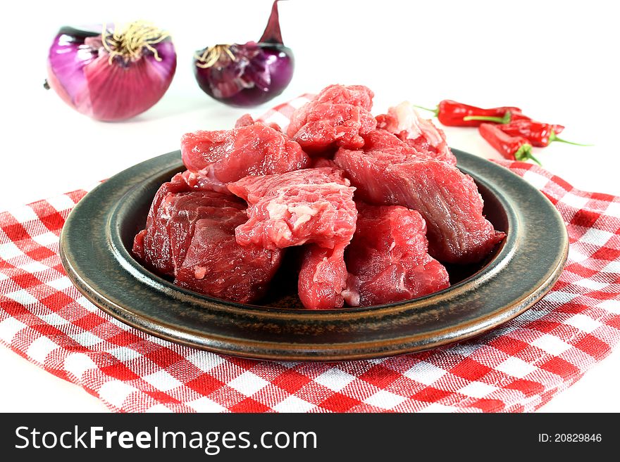 A plate of fresh raw beef goulash