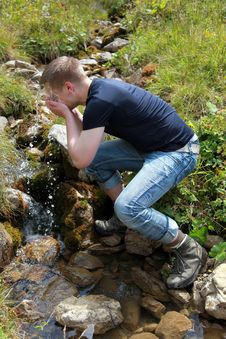 Young Man Taking A Refreshment In The Mountains Royalty Free Stock Photo Young Man Taking A Refreshment In The Mountains Royalty Free Stock Photo