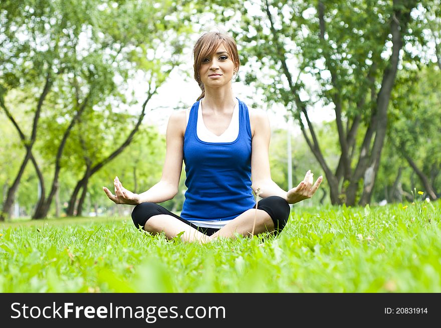 Yoga Woman On Green Grass