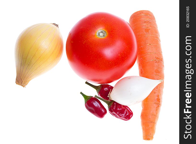 Tomato, onion, garlic, chilli, carrot on a white