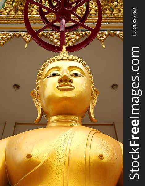 Buddha image in front of church, Wat Naga Wichai, Mahasarakam, Thailand