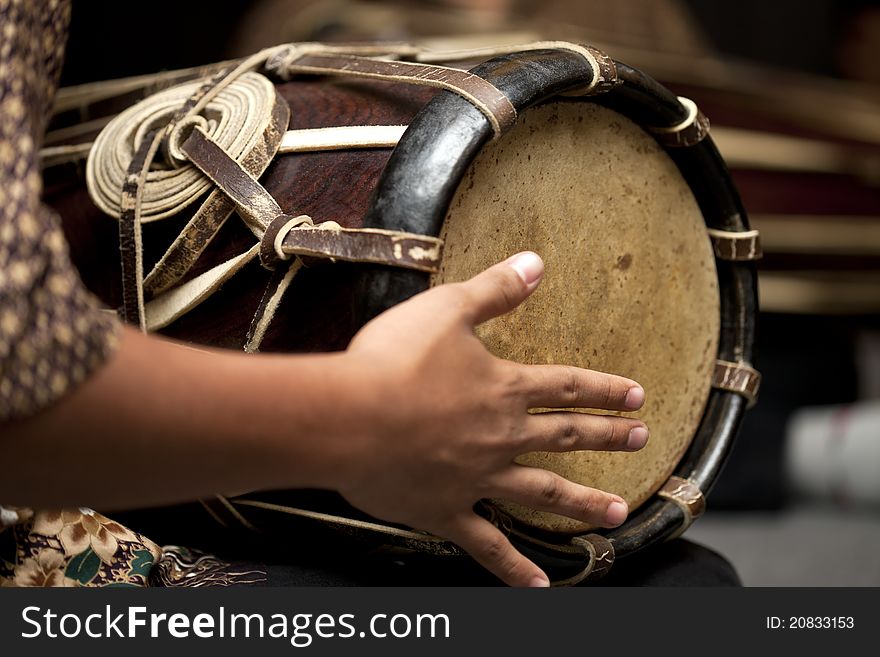 A Man Playing Thai Drum