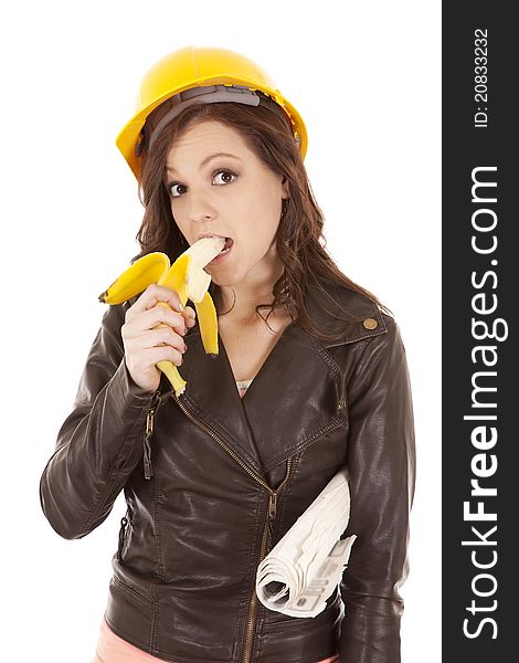 A construction worker woman getting ready to eat her fruit. A construction worker woman getting ready to eat her fruit