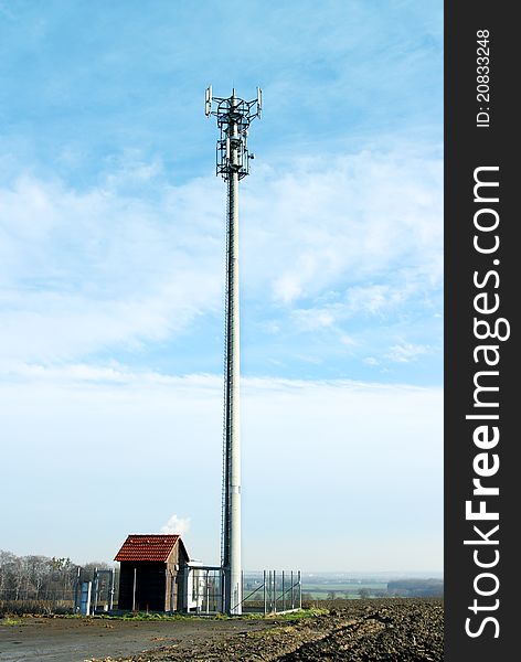 Transmitter with blue sky and clouds