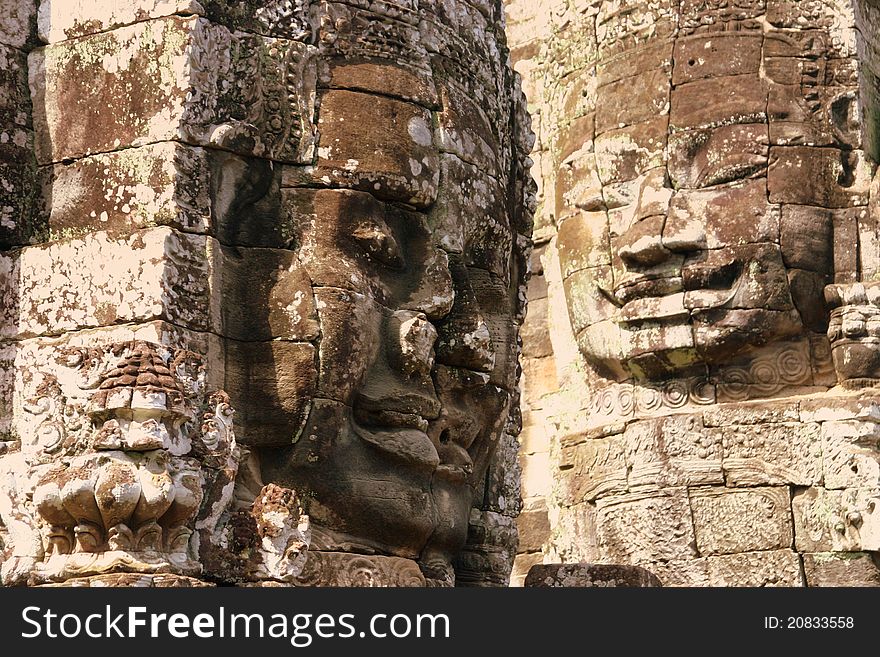 The Bayon is a Khmer temple at Angkor in Cambodia, built in the late 12th century or early 13th century as the official state temple of the Mahayana Buddhist King Jayavarman VII Following Jayavarman's death, it was modified and augmented by later Hindu and Theravada Buddhist kings in accordance with their own religious preferences. The Bayon's most distinctive feature is the multitude of serene an. The Bayon is a Khmer temple at Angkor in Cambodia, built in the late 12th century or early 13th century as the official state temple of the Mahayana Buddhist King Jayavarman VII Following Jayavarman's death, it was modified and augmented by later Hindu and Theravada Buddhist kings in accordance with their own religious preferences. The Bayon's most distinctive feature is the multitude of serene an