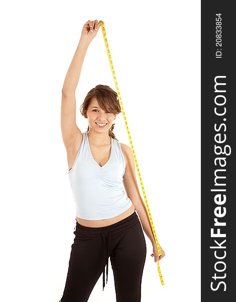 A woman holding up a measuring tape. A woman holding up a measuring tape.