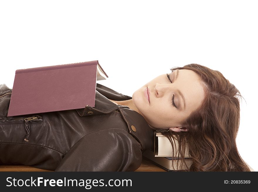 A woman taking a break from reading and falling asleep. A woman taking a break from reading and falling asleep.