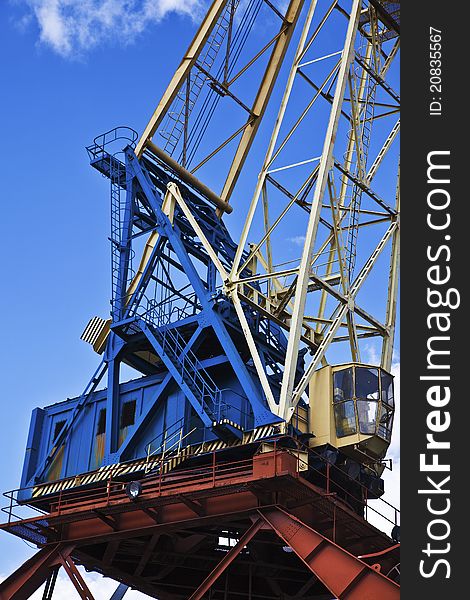 Industrial grabber cranes on blue