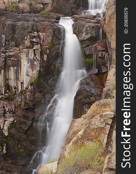 Pretty alpine waterfall in Northern California with motion blurred water cascade. Pretty alpine waterfall in Northern California with motion blurred water cascade