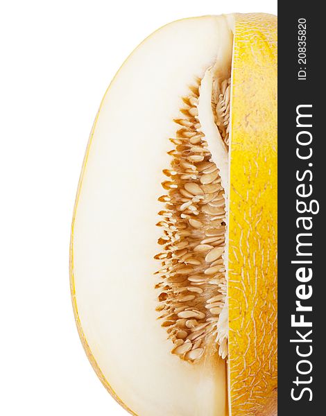 Sliced melon with many seeds over white background