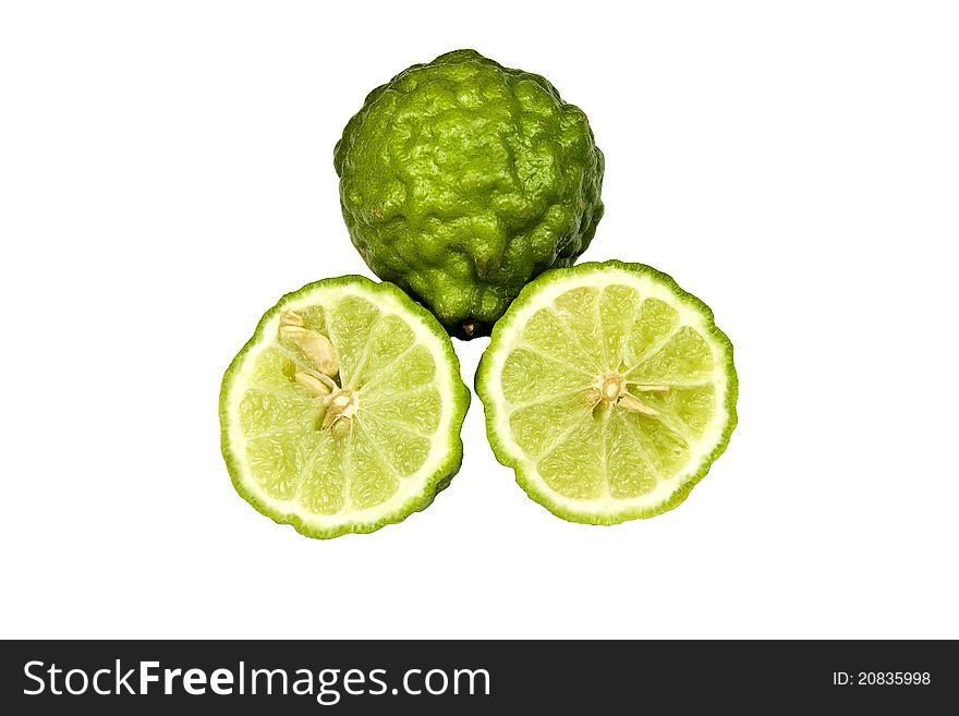 Rough kaffir limes with a bumpy exterior isolated on white background