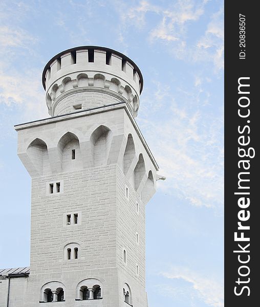 Tower of Neuschwanstein castle in Bavaria over beautiful blue sky