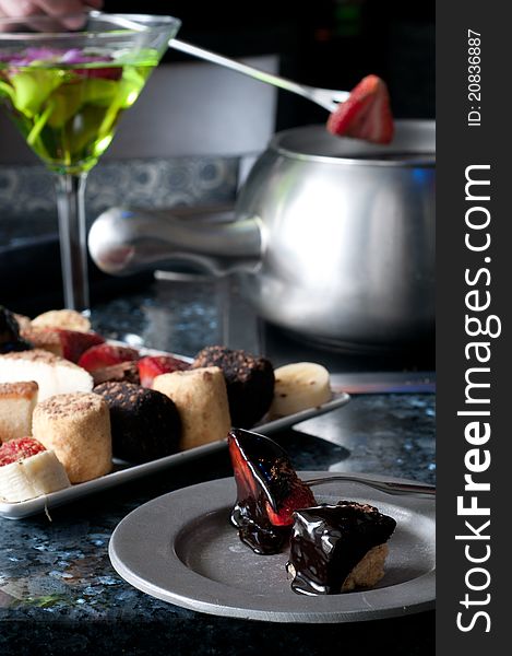 Dessert fondue plate with hot melted fudge. Dessert fondue plate with hot melted fudge