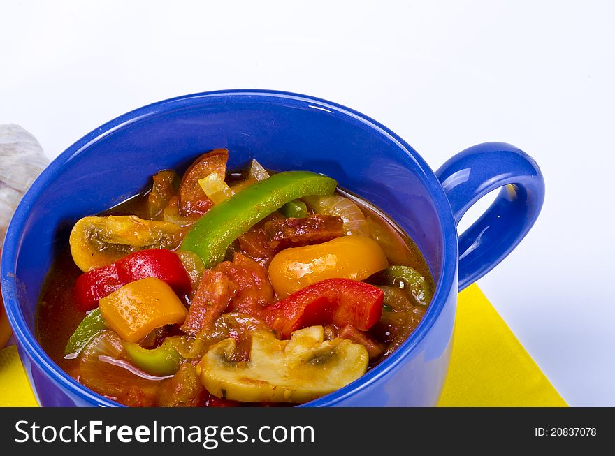 Lecsó is an originally Hungarian thick vegetable stew which features peppers and tomato, onion, lard, salt, sugar and ground paprika as a base recipe