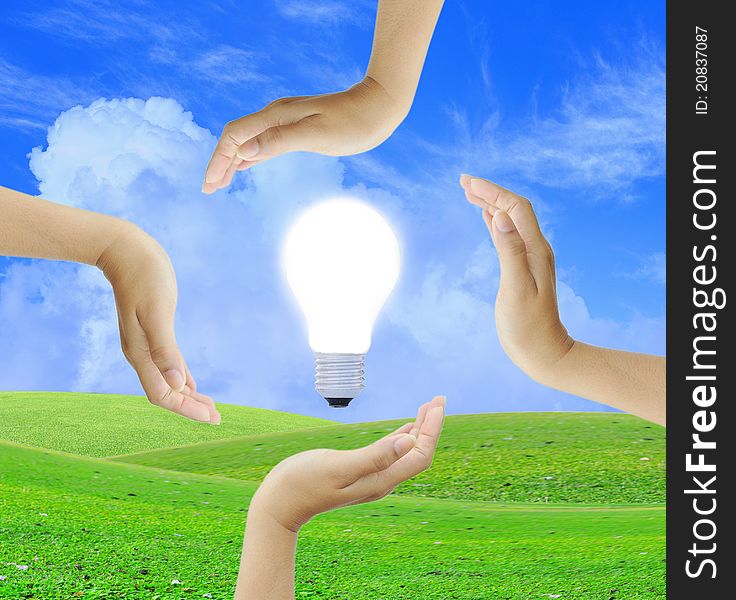 Women hand with Light bulb and blue sky
