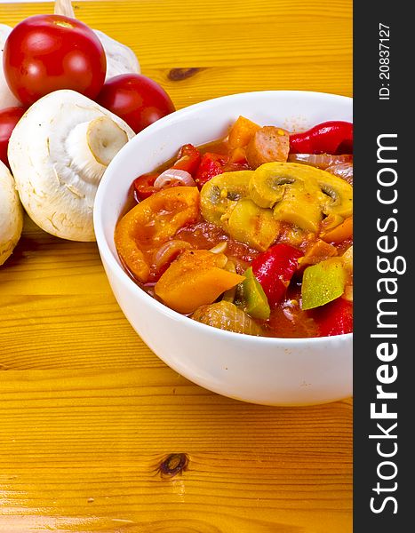 Lecho is an originally Hungarian thick vegetable stew which features peppers and tomato, onion, lard, salt, sugar and ground paprika  as a base recipe