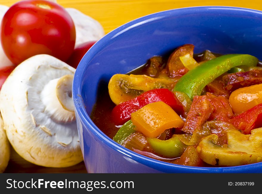 LecsÃ³ is an originally Hungarian thick vegetable stew which features peppers and tomato, onion, lard, salt, sugar and ground paprika  as a base recipe