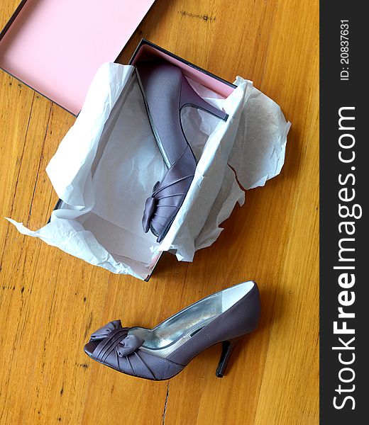 Ladies high heeled shoes in a shoe box