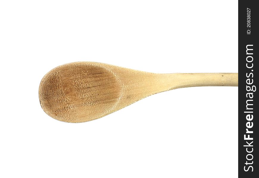 A wooden spoon isolated against a white background