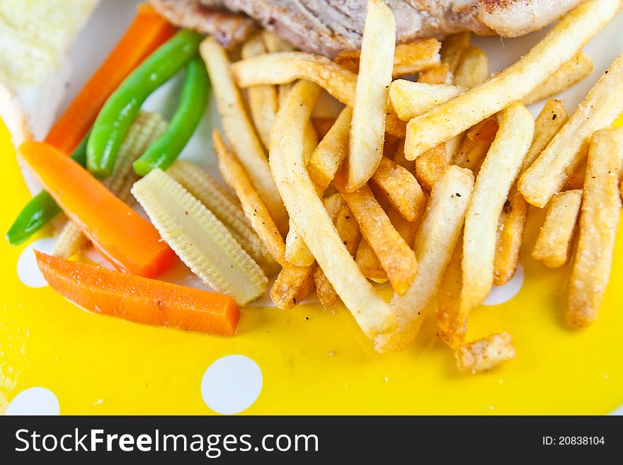 French fries on yellow dish