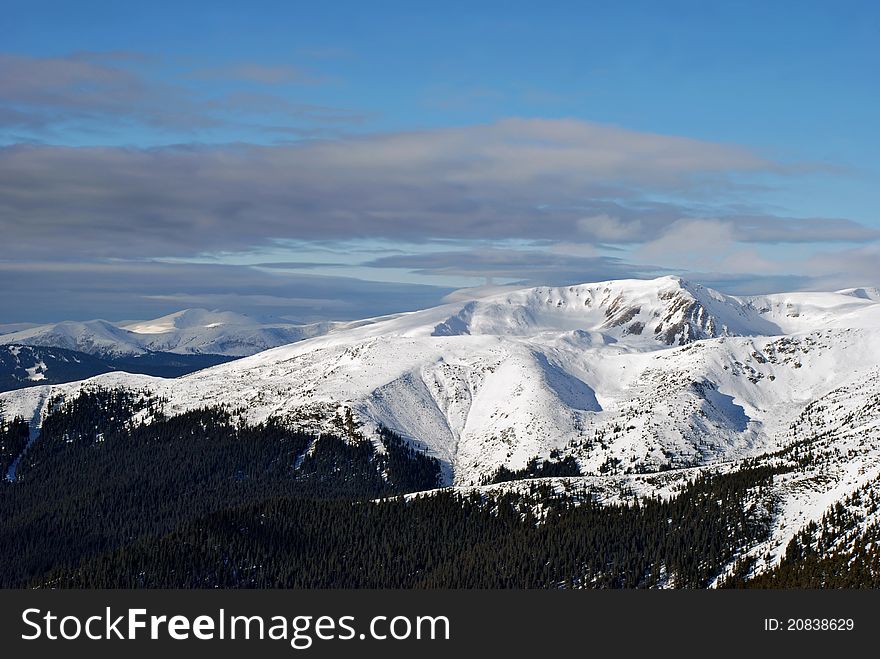 Winter in mountains in a landscape with mountain tops