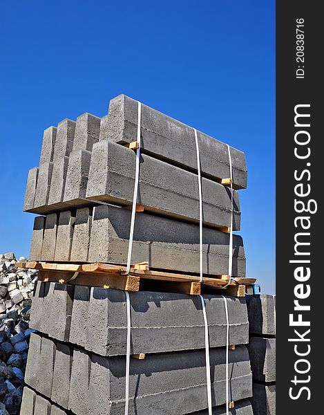 The pallet with a border on a building site against the sky.