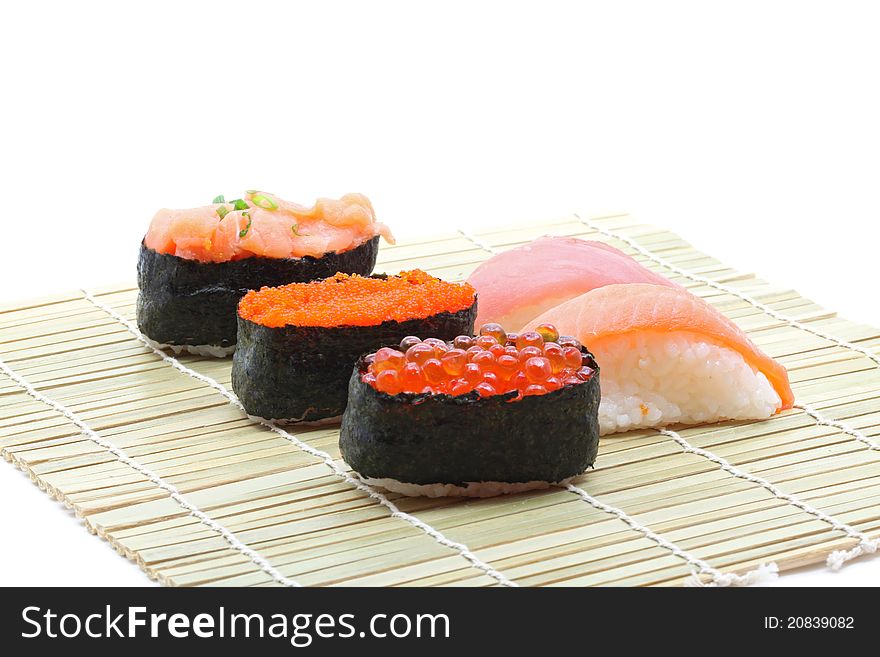 Fresh seafood sushi set on traditional bamboo dish