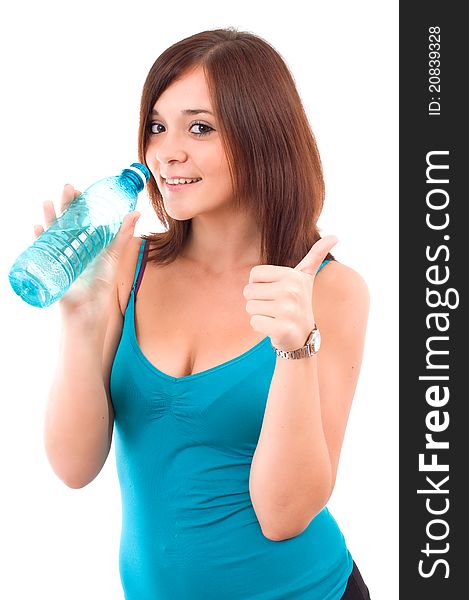 Thirsty young woman with water after fitness workout. Isolated on white. Thirsty young woman with water after fitness workout. Isolated on white