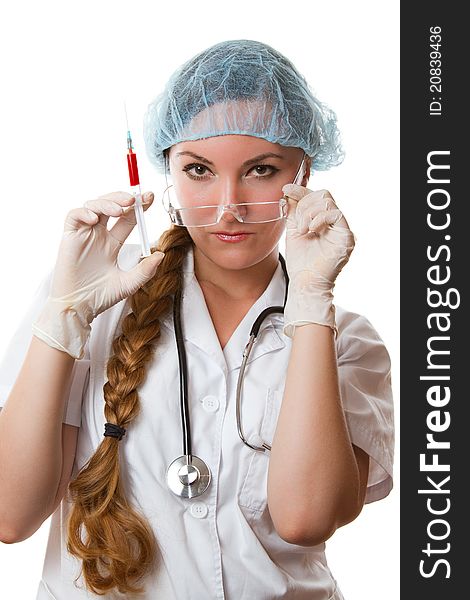 Physician with long hair in a white gown and gloves holding medical syringe with blood on an isolated white background. Physician with long hair in a white gown and gloves holding medical syringe with blood on an isolated white background