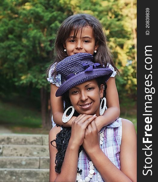 Mother and daughter in a summer day