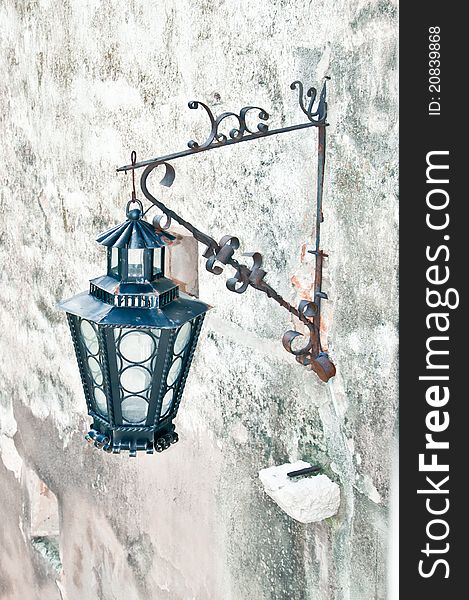 Old styled wall lamp on a medieval castle. Old styled wall lamp on a medieval castle