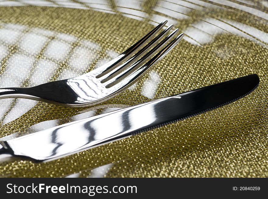 Photo of fork and knife on a plate